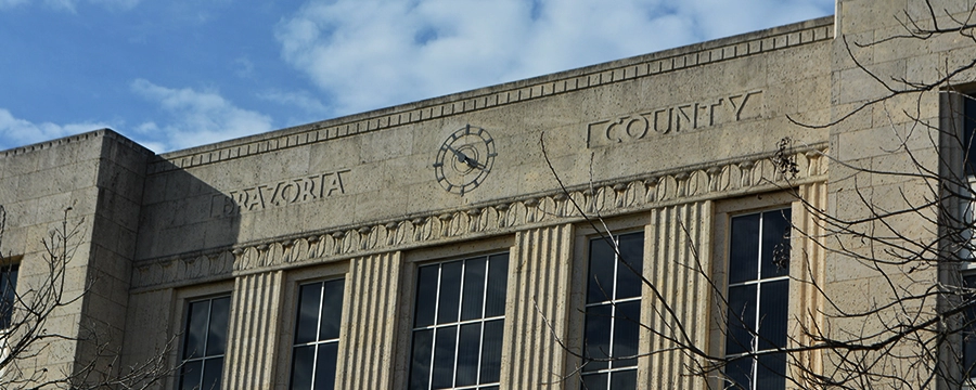 Brazoria County Courthouse exterior in Angleton, TX with classic stone architecture and tall windows