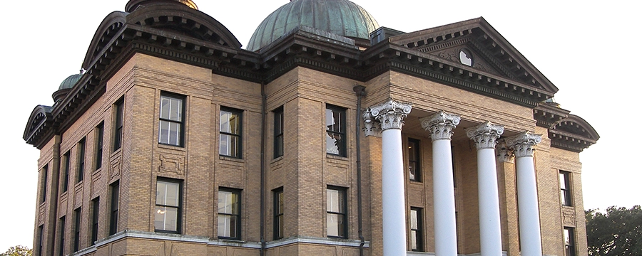 Historic Fort Bend County Courthouse with domed roof and white columns