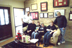 Team of private investigator Houston professionals gathered in a welcoming office setting