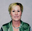 Stephany Weight professional headshot with short blonde hair and green jacket